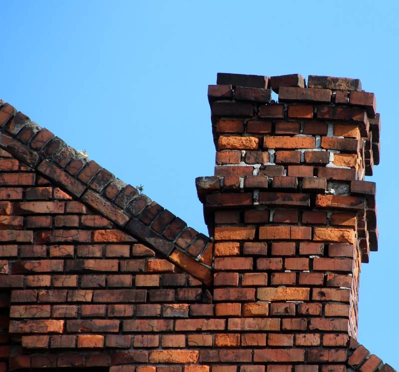 Damaged chimney on an Stevenson Ranch home showing cracks and missing mortar